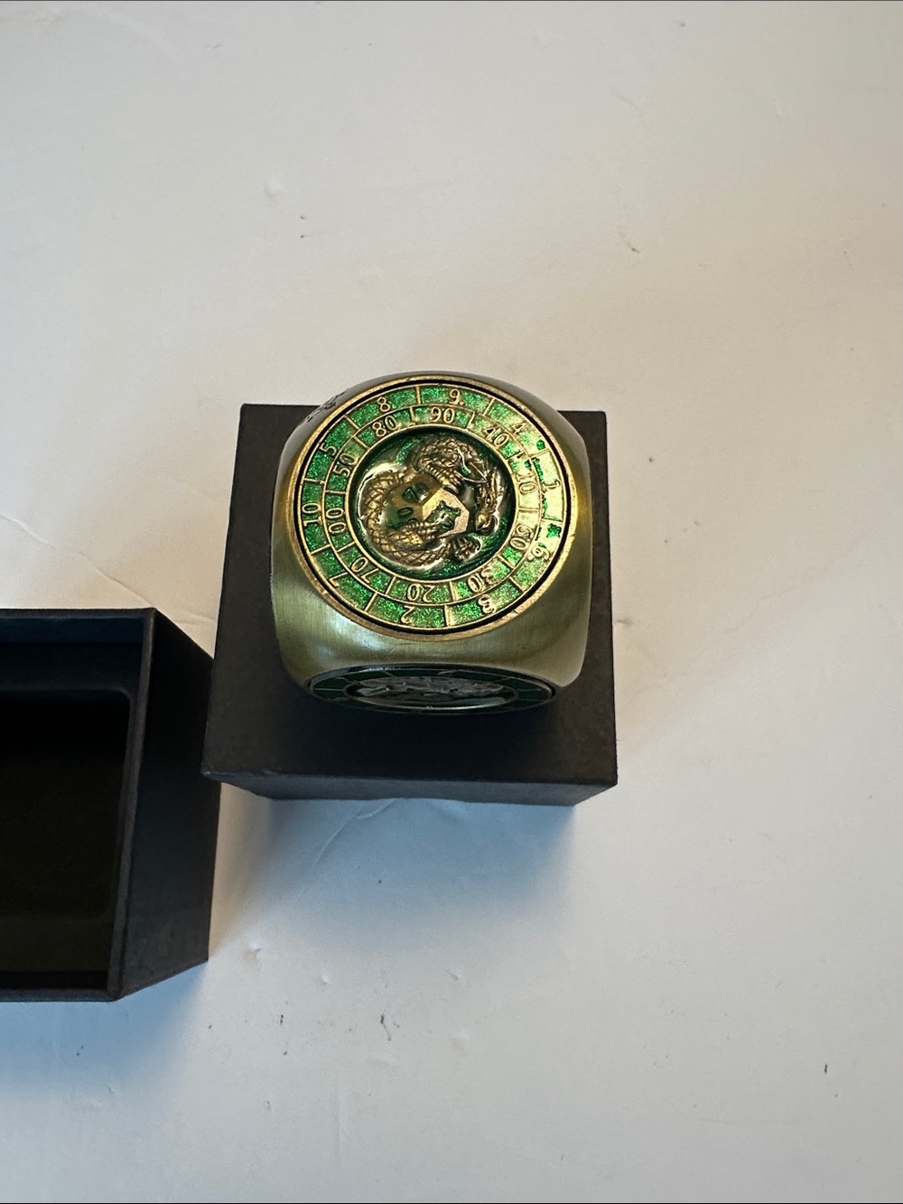 - Collectible Toy Accent green spinning die for dungeons and dragons